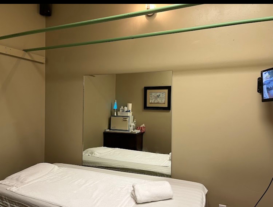 Clean treatment room with massage table